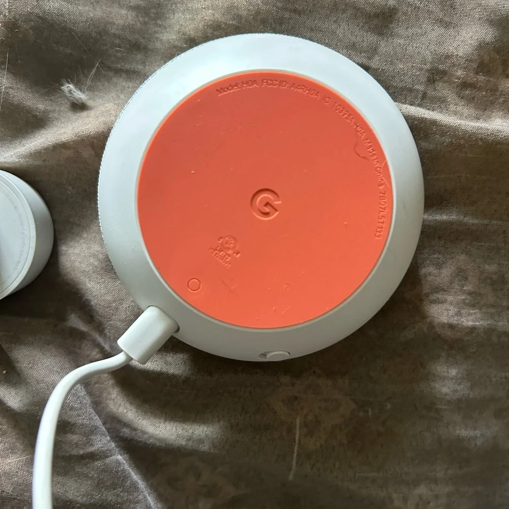 Google Mini Home nest color grey and orange. Comes with power cord.